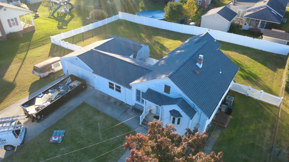 Drone view of a finished shingle roof replacement on a white ranch home in South Jersey
